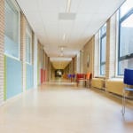 school corridor with coloured chairs